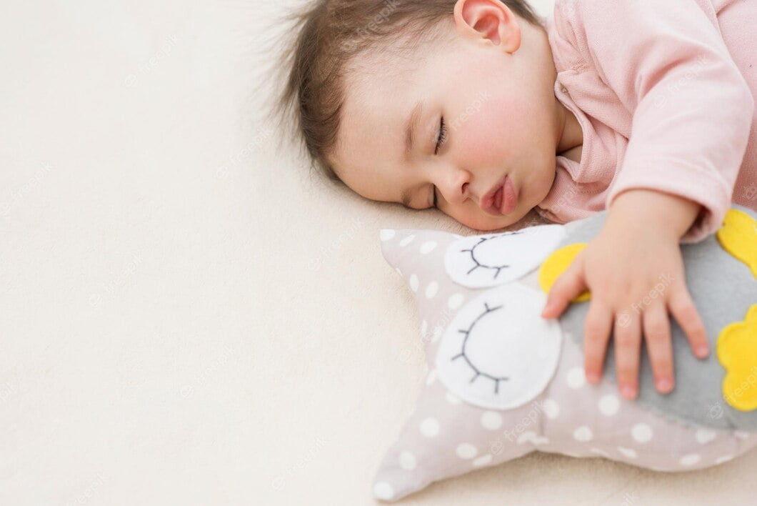 closeup-sleeping-dreaming-beautiful-baby-girl-toddler-with-owl-toy-bed_616427-317