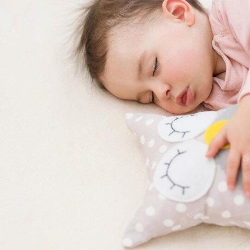 closeup-sleeping-dreaming-beautiful-baby-girl-toddler-with-owl-toy-bed_616427-317